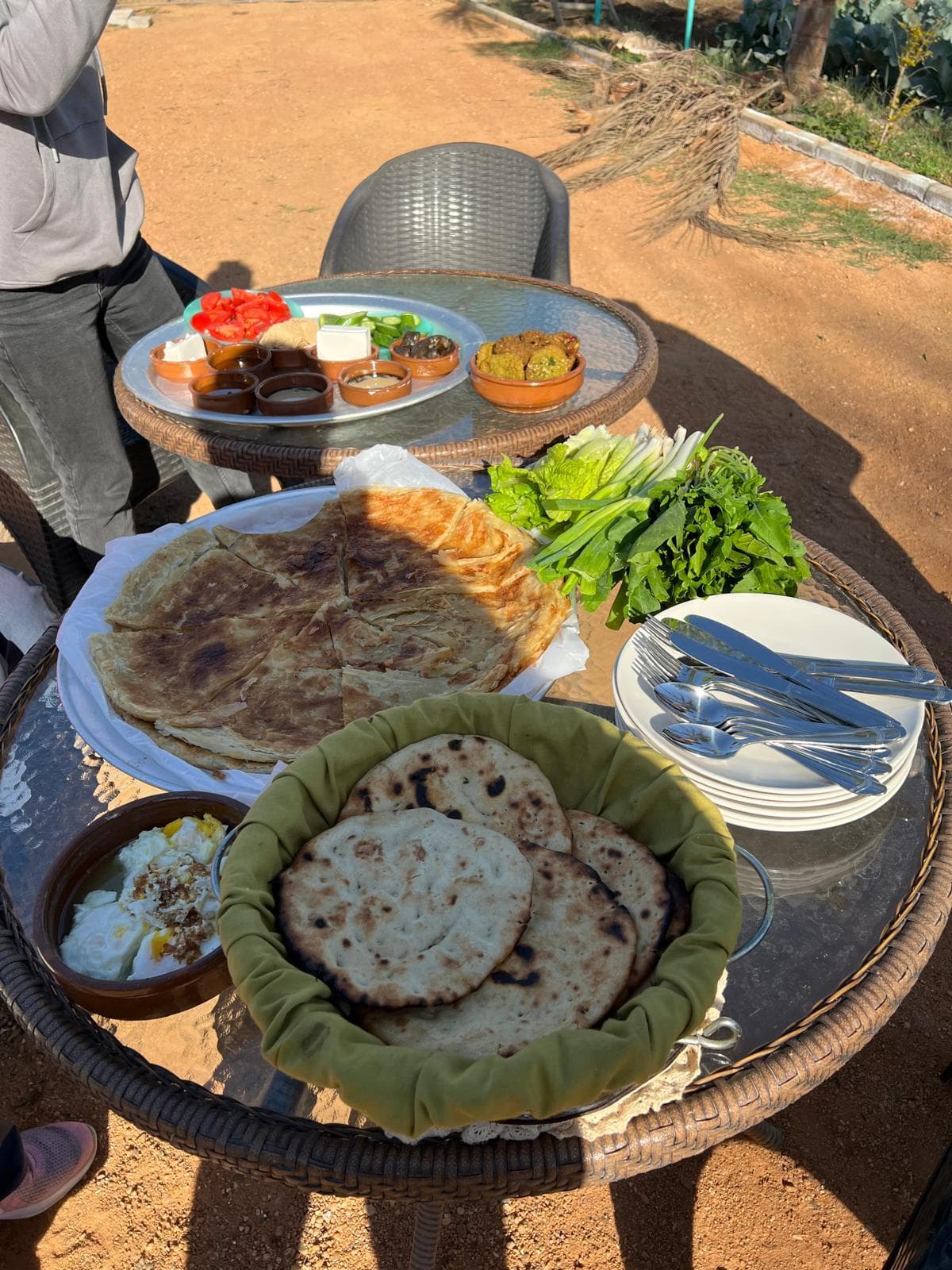 Farm breakfast spread at Mansouria — fiteer meshaltet, cheeses, honey, fresh greens